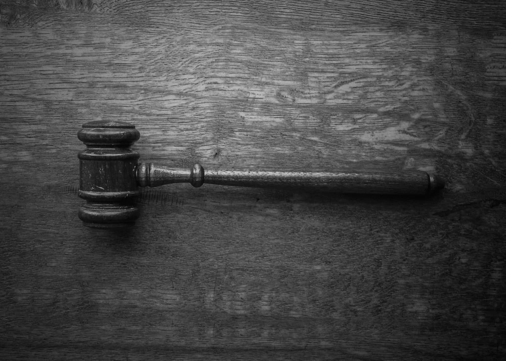 A wood gavel on a wood table